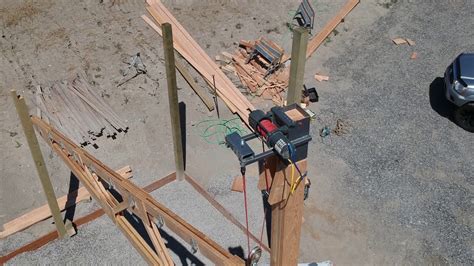 Then take a 12' 2x6, bolt it to the 2x4s, and bolt your 8 foot hoist rail to that so that even on the ends the weight is supported by three <b>trusses</b>. . Pole barn truss winch system